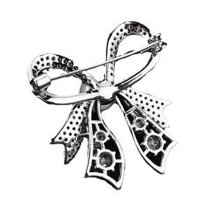 Sparkling silver bow brooch with micro-paved cubic zirconia for elegant women's sweaters