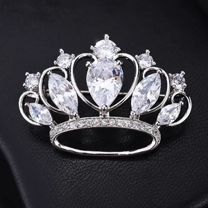 Macro view showing brilliant AAA cubic zirconia stones on the silver crown brooch