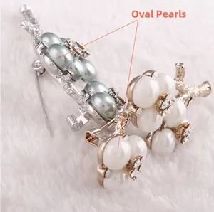 Macro shot of oval pearls and crystal floral brooch on white faux fur background