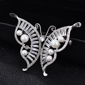 Luxury butterfly brooch with sparkling zircons and pearls on silver metal base