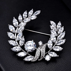 Luxurious silver laurel wreath brooch featuring sparkling marquise and round zircon stones
