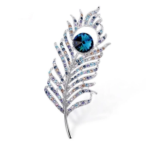 Elegant silver feather brooch with blue crystals and large faceted round gemstone