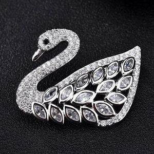 Elegant silver swan brooch featuring marquise-cut crystals and sparkling zircon accents