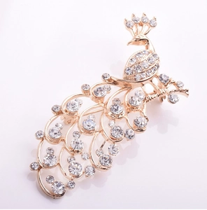 Close-up of peacock brooch with rose gold finish and white crystal pavé setting