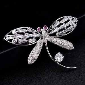 Luxury silver-plated dragonfly brooch with shimmering zircon crystals on black leather