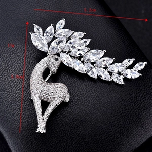 Detailed macro view showing the 5.2cm width dimensions of this crystal deer brooch