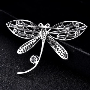 Back view of luxury crystal dragonfly brooch with secure pin and intricate hollow detailing