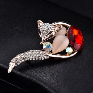 Golden fox brooch with red oval gem, cat eye stones and sparkling crystals on black leather