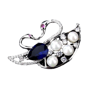 Elegant silver double swan brooch with deep blue pear-cut gemstone and white pearls
