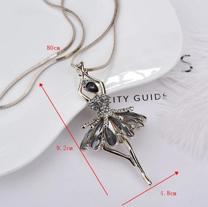Detail of elegant ballerina pendant sweater necklace with crystals and silver snake chain