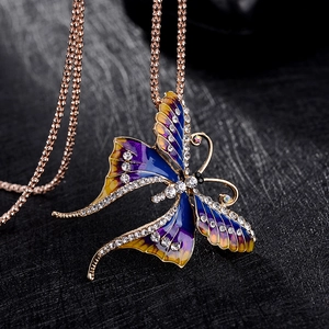 Elegant rose gold butterfly pendant necklace with purple and blue crystals and rhinestones