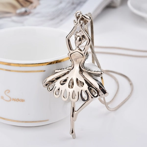 Macro shot of a silver ballerina pendant with intricate hollowed-out skirt detail