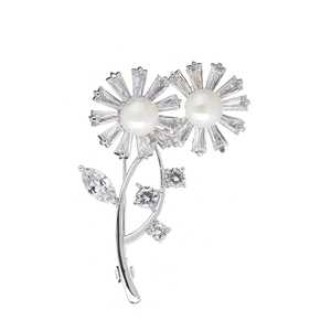 Elegant silver sunflower brooch with shimmering cubic zirconia petals and white pearls