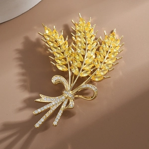 Exquisite golden wheat ear brooch with yellow crystals and sparkling pearl bow accent