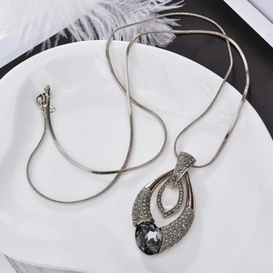 Elegant long teardrop pendant necklace with grey gemstone and white rhinestones