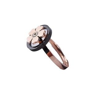 Rotating snowflake open ring in rose gold finish with black geometric floral design