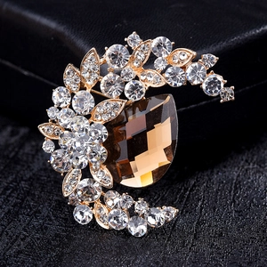 Vintage gold moon brooch with clear rhinestones and brown teardrop crystal centerpiece