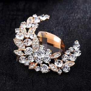 Vintage crescent moon brooch with amber pear-shaped gemstone and crystal flowers