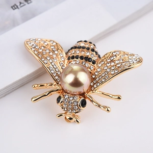 Broche abeille élégante avec strass brillants et grande perle de couleur champagne incrustée