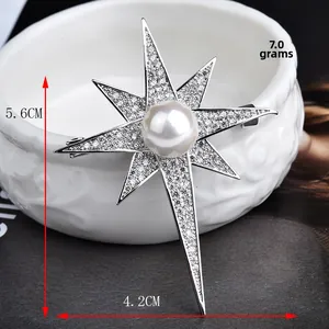 Detail of star brooch with large pearl and zircon inlay, size 5.6cm by 4.2cm
