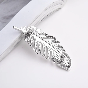 Exquisite silver feather brooch with zircon crystals, back view showing secure pin clasp