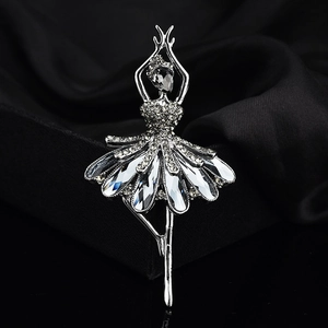 Elegant silver ballet dancer brooch with sparkling rhinestones on black silk fabric