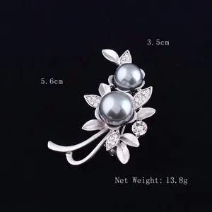 Detail view of flower brooch with gray pearls and crystals, size 3.5cm x 5.6cm