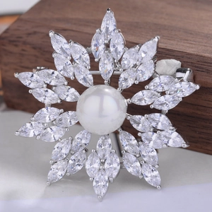 Elegant snowflake brooch with white pearl and marquise-cut cubic zirconia in platinum finish