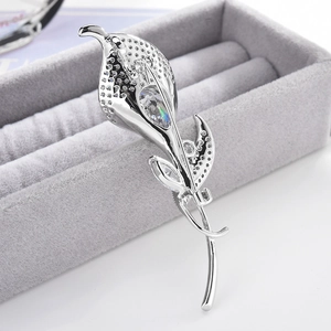 Elegant silver Calla Lily brooch featuring a large pear-cut cubic zirconia stone inlay