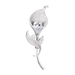 Elegant silver calla lily brooch featuring micro-set cubic zirconia and a pear-cut centerpiece