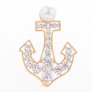 Elegant gold anchor brooch with sparkling crystals and a white pearl for women
