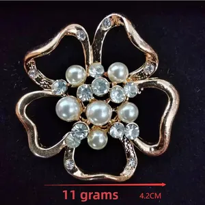 Detail view of flower brooch with pearls and crystals measuring 4.2cm and weighing 11g