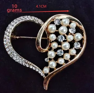 Detail view of heart brooch with pearls and crystals, measuring 4.1cm and weighing 10g