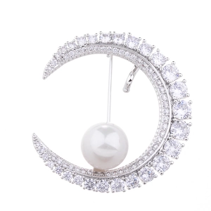 Elegant crescent moon brooch with silver finish, sparkling zircons and white pearl inlay