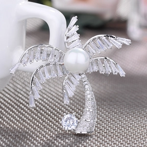 Elegant silver coconut tree brooch with white pearl and sparkling zircon stones
