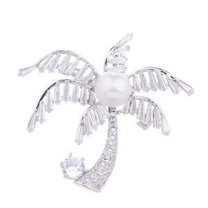 Elegant silver coconut tree brooch with white pearl and sparkling baguette-cut zircons