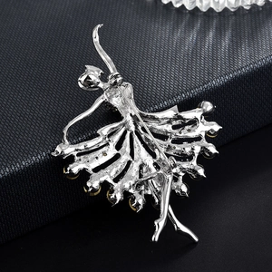 Elegant silver ballet dancer brooch with amber stones shown from a back clasp view