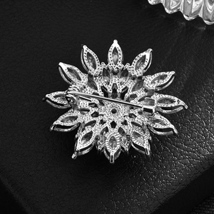 Silver snowflake brooch with marquise cubic zirconia showing detailed honeycomb metal back