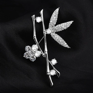 Elegant silver bamboo and plum blossom brooch with clear cubic zirconia inlays