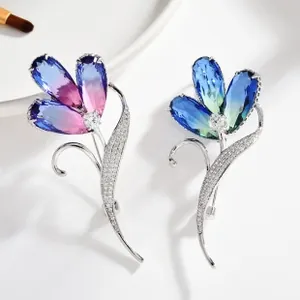 Macro detail of tulip brooches featuring gradient crystals and micro-set cubic zirconia