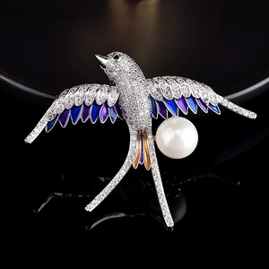 Exquisite swallow brooch with sparkling crystals, purple gradient enamel, and white pearl