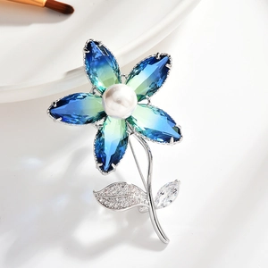 Elegant floral tourmaline brooch with blue-green gradient petals and micro-pave zircons