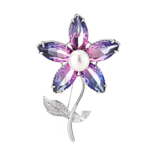 Elegant floral brooch with purple gradient crystal petals and white pearl center on silver