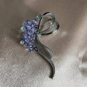 Elegant silver-plated flower brooch with purple drop-shaped crystals and white zircons