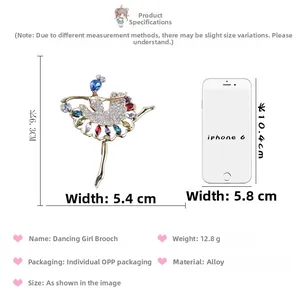 Detailed size comparison of dancing girl brooch with colorful crystals next to a phone