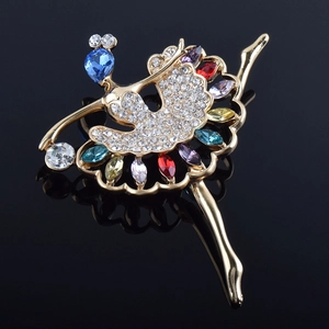 Macro shot of dancing girl brooch with colorful marquise crystals and gold plating