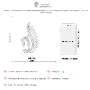 Comparaison détaillée de la taille d'une broche fleur en zircon (5,7x3cm) avec un téléphone