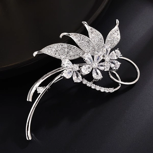 Exquisite silver flower brooch with crystal pavé leaves and elegant pearl accents