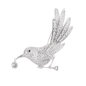 Elegant bird brooch in silver finish with pavé zircon stones and dangling pendant charm