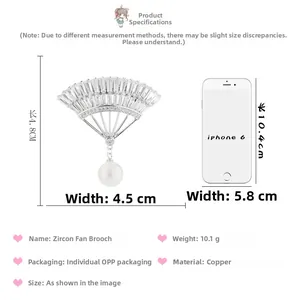 Detail view showing dimensions of fan-shaped zircon brooch with a hanging white pearl